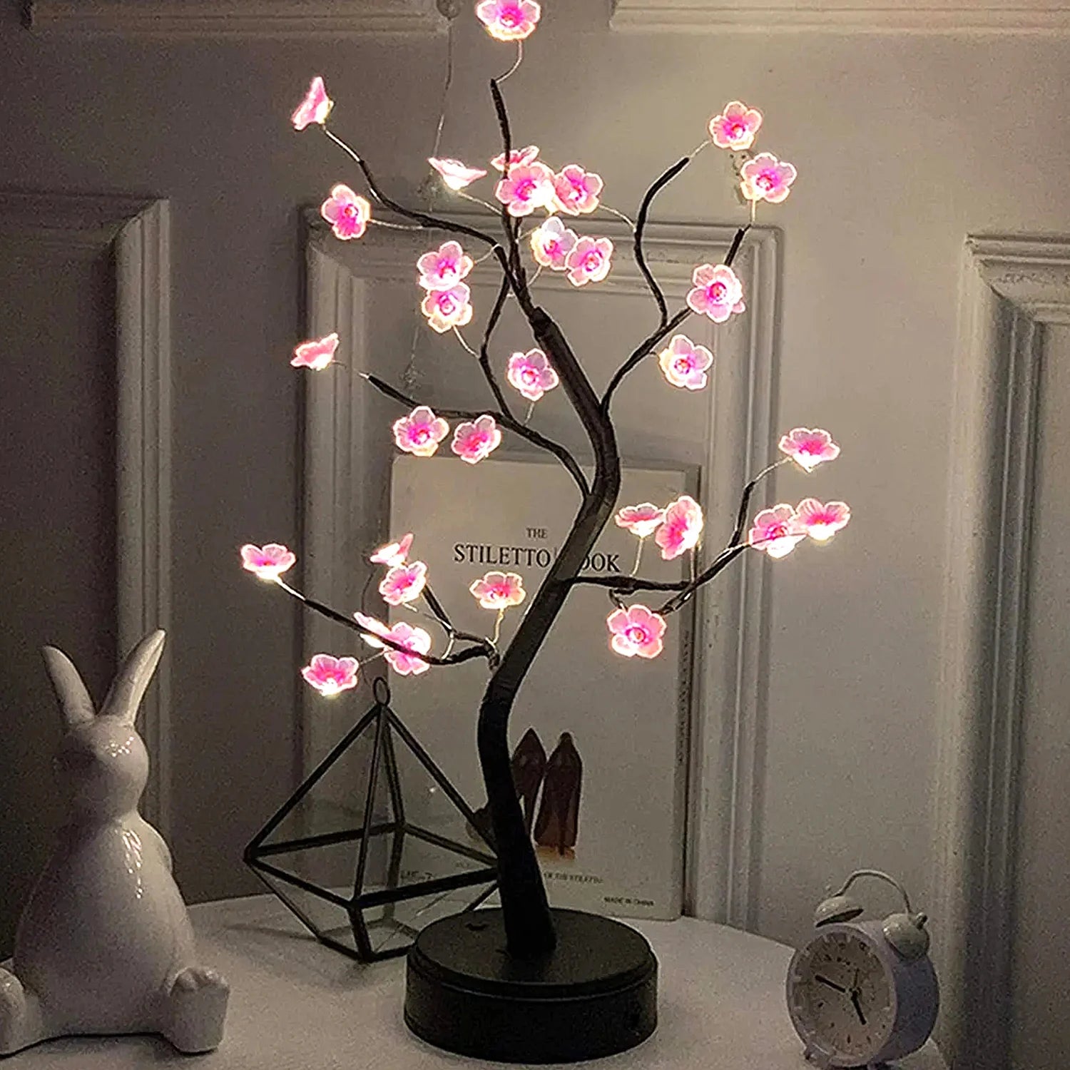 Cherry Blossom Tree Lamp glowing on a nightstand
