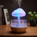 Raining Cloud Aromatherapy Humidifier glowing on a minimal desk