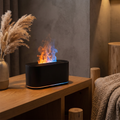 Flame effect essential oil diffuser with colorful water vapor on a wood shelf