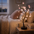 Cherry Blossom Tree Lamp glowing on a cozy nightstand