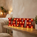 LED Marquee Letters spelling LOVE on a shelf